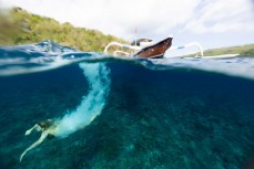 Rewa Morrison diving off a traditional boat at Gamut, near Nusa Penida, Indonesia.