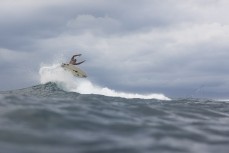 A local surfer gets air at Lacerations surf break at Nusa Lembongan, Indonesia.