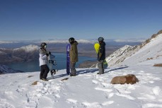 Rewa Morrison, Eman and Marlee Silva discuss their next lines at Ohau ski field, Ohau, Otago, New Zealand.