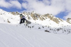 Rewa Morrison grabs during early spring at The Remarkables ski field, Queenstown, Central Otago, New Zealand.