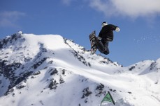 A snowboarder makes then most of early spring at The Remarkables ski field, Queenstown, Central Otago, New Zealand.