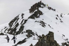 Rewa Morrison and Marlee Silva climb the peak at Round 3 of the 2023 NZ Junior Freeride Tour held at Mt Olympus ski area, Canterbury, New Zealand.