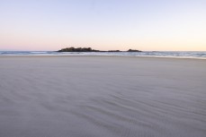 Dusk over Bird Island at Smaills Beach, Dunedin, New Zealand.