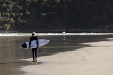 Keo Morrison walks down the beach to a remote break near Otago Peninsula, Dunedin, New Zealand.
Photo: Derek Morrison