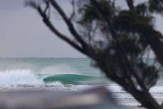 Isaac Chadwick films a surfer at a remote beachbreak in the Catlins, New Zealand. Photo: Derek Morrison