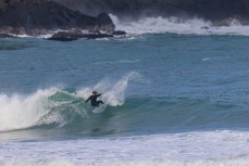 Keo Morrison cranks a turn at a remote beachbreak in the Catlins, New Zealand. Photo: Derek Morrison