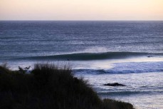 Dusk peaks with a fun swell at Blackhead, Dunedin, New Zealand.Photo: Derek Morrison