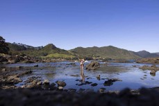 Anna and Josh explore the coastline near Lottin Point on the East Cape, New Zealand.