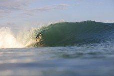 A surfer gets tubed at Bingin, Bali, Indonesia.