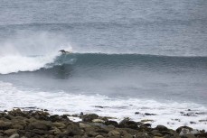 Felix Gibson enjoys a blustery cold day of surfing at a remote pointbreak in the Catlins, New Zealand. Photo: Derek Morrison