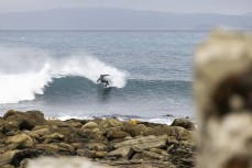 Keo Morrison on a blustery cold day of surfing at a remote pointbreak in the Catlins, New Zealand. Photo: Derek Morrison