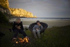 Keo and Felix relax at a remote beachbreak in the Catlins, New Zealand. Photo: Derek Morrison