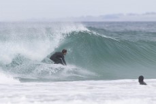 Olympian Billy Stairmand stalls for a barrel during a freesurf at the 2024 New Zealand Surfing Championships held at Blackhead, Dunedin, New Zealand.