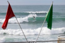 Alexis Owen between the flags at St Clair, Dunedin, New Zealand.
Photo: Derek Morrison