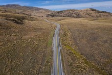State Highway 85 cuts through tussockland in the Maniototo, Otago, New Zealand.