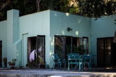 A house sits derelict after a landslide at Piha, Auckland, New Zealand.