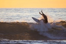 Rewa Morrison enjoys a surf at Piha, Auckland, New Zealand.