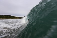 Jack McLeod gets tubed at Blackhead, Dunedin, New Zealand.