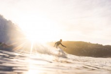 A surfer takes off at Lyall Bay,  Wellington, New Zealand.