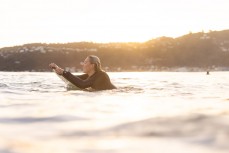 A surfer makes thermost of a new sas it well wraps into south-facing beaches in Wellington, New Zealand.