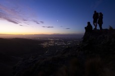 Climbers Nacho Reyes, of Spain, Will Holmes, of Wellington, and Julia Hochstein, of Canada take in the city lights of Christchurch, Canterbury, New Zealand. Photo: Derek Morrison