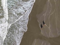 Horse riding on Woodend Beach, Woodend, Canterbury, New Zealand.