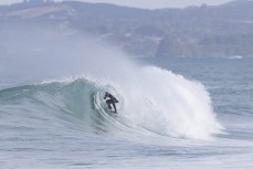 A surfer gets barreled at Blackhead, Dunedin, New Zealand.