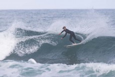 Nixon Reardon throwing buckets at Blackhead, Dunedin, New Zealand.