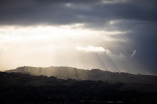 Storm clouds and sun rays over Otago Peninsula, Dunedin, New Zealand.
Photo: Derek Morrison