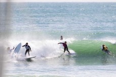 Party wave with Tom Butland, Poppy Arkle, Kyra Wallis and Tom Carroll at Manu Bay, Raglan, Waikato, New Zealand.