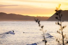 Dawn runners at Raglan, Waikato, New Zealand.