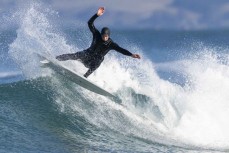 Josh Thickpenny sets the fins free during a fun winter swell at Blackhead, Dunedin, New Zealand.