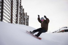Tash Mattingly top turn at Cardrona ski field, Cardrona Valley, Wanaka, New Zealand.