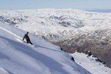 Derek rides in bound powder at Cardrona ski field, Cardrona Valley, Wanaka, New Zealand.
