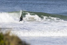 Jeff Patton bottom turns at Blaclhead, Dunedin, New Zealand. Photo: Derek Morrison