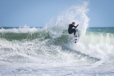 Luke Dymond hits a section during a spring swell at Manu Bay, Raglan, Waikato, New Zealand.