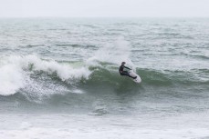 Keo Morrison makes the most of a spring swell at Manu Bay, Raglan, Waikato, New Zealand.