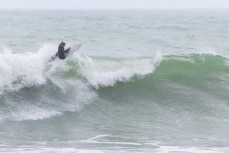 Keo Morrison makes the most of a spring swell at Manu Bay, Raglan, Waikato, New Zealand.