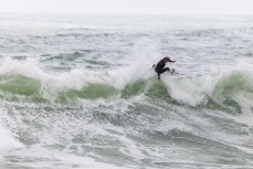 Keo Morrison makes the most of a spring swell at Manu Bay, Raglan, Waikato, New Zealand.