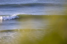 A surfer locks in on a left during a fun four-swell combo at Blackhead, Dunedin, New Zealand.Photo: Derek Morrison