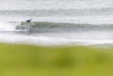 Jake Owen during a swell on the north coast of Dunedin, New Zealand.