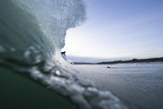 A surfer drops into wave during a small swell at St Kilda, Dunedin, New Zealand.Photo: Derek Morrison