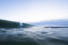 A surfer drops into wave during a small swell at St Kilda, Dunedin, New Zealand.Photo: Derek Morrison