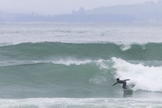 Max Wooffindin finding form during a swell on the north coast of Dunedin, New Zealand.