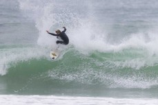 Lewis Murphy on form during a swell on the north coast of Dunedin, New Zealand.