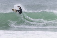 Lewis Murphy sends it during a swell on the north coast of Dunedin, New Zealand.