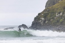 A surfer makes the most of a swell on the north coast of Dunedin, New Zealand.