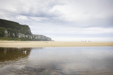The Bryce family play touch on a remote beach break in the Catlins, New Zealand. Photo: Derek Morrison