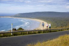 Young surfers (from left) Lewis Murphy, Alexis Owen and Keo Morrison hunt for waves at a remote beach break in the Catlins, New Zealand. Photo: Derek Morrison