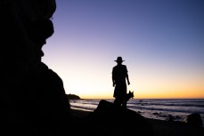 Keo Morrison and Remi at sunset on the Surf Coast Highway SH45, near New Plymouth, Taranaki, New Zealand.